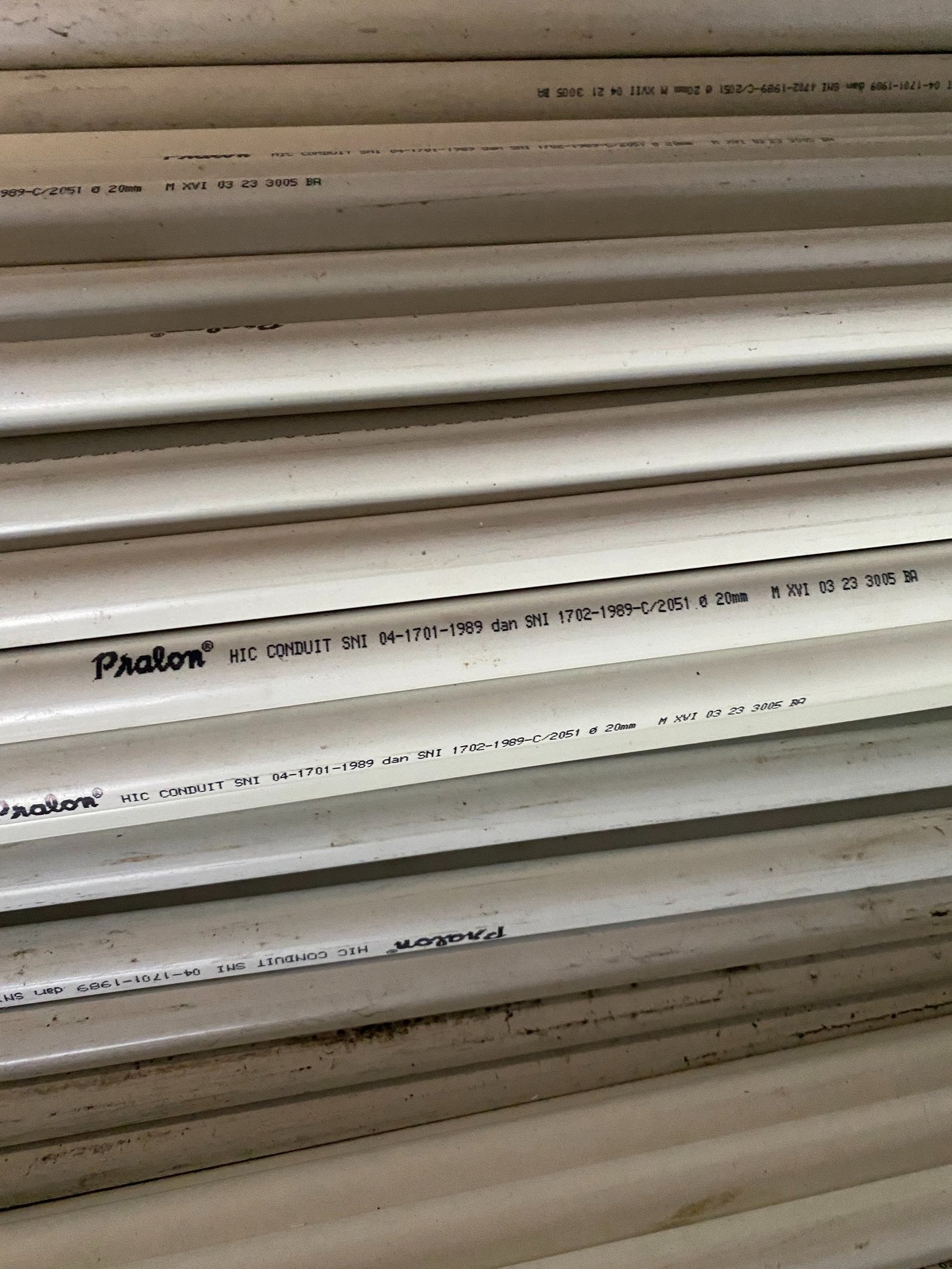 a stack of pipes and pipes in a warehouse Distributor Pralon